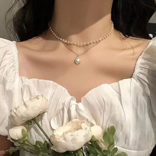 Lustrous Essence: Dual Strand Pearl Necklace