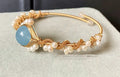 Sapphire Gleam Pearl Bracelet: Gilded Elegance - Bracelet