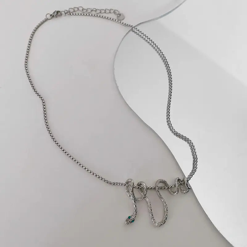 Serpentine Charm: Timeless Titanium Necklace